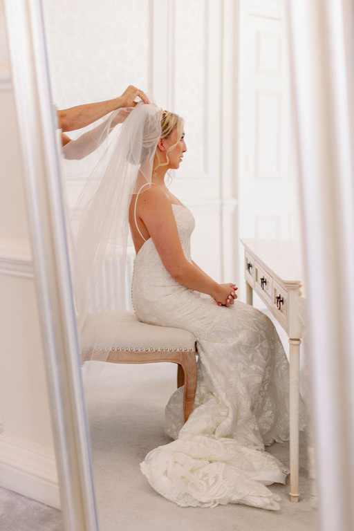 bridal low bun hair styles and wedding hairstyle and bride hair by Pam Wrigley at Hedsor House, london