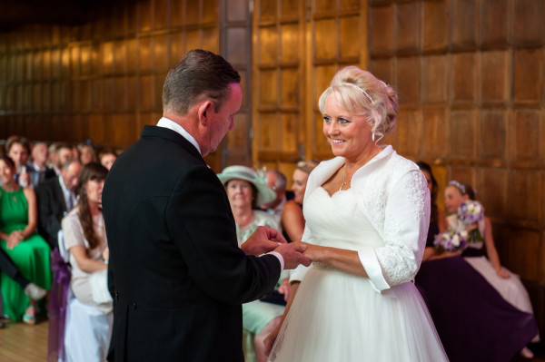 Smoky bridal makeup and bridal high bun hairstyles for mature brides with medium length hair. Plus makeup by wedding makeup artist and bridal hair stylist Pam Wrigley in Surrey.