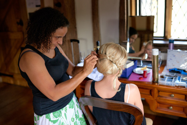 trial run. Beautiful natural bridal hair for the bride by Pam Wrigley. Plus messy low bun with braids wedding hairstyle for long hair by wedding makeup artist and bridal hair stylist in London.