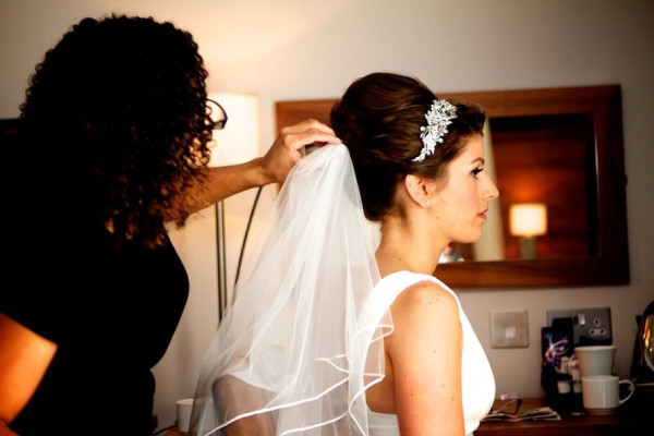Wedding natural makeup and bridal hair in a vintage hairstyle for a bride. By Pam Wrigley wedding makeup artist and bridal hair stylist, London.