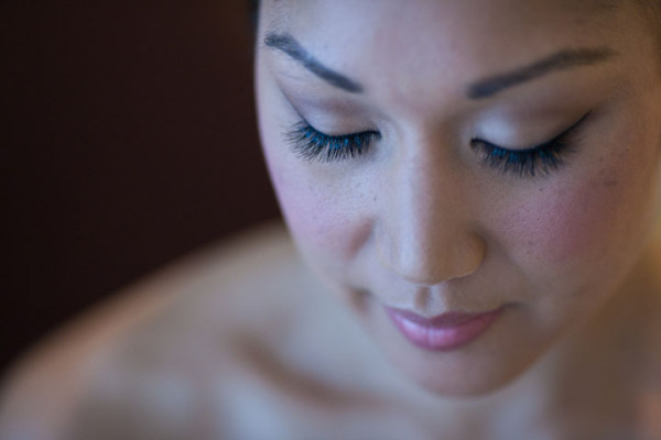 Wedding natural makeup with individual lashes, and bridal hair in a low bun hairstyle for an Asian, Chinese bride. By Pam Wrigley wedding makeup artist and bridal hair stylist, London.