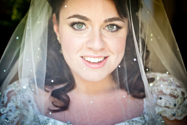 Wedding natural makeup, full lashes and bridal hair in a half up curly hairstyle for a bride. By Pam Wrigley wedding makeup artist and bridal hair stylist, London.