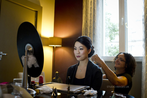Wedding natural makeup and bridal hair in a low bun hairstyle for a Chinese, Asian bride. By Pam Wrigley wedding makeup artist and bridal hair stylist, London.