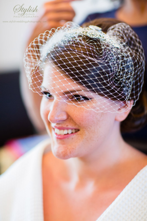 Wedding vintage makeup and bridal hair in a low bun vintage hairstyle for a bride. By Pam Wrigley wedding makeup artist and bridal hair stylist, London.