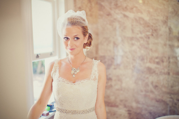 Wedding natural vintage makeup and bridal hair in a low bun hairstyle for a bride. By Pam Wrigley wedding makeup artist and bridal hair stylist, London.