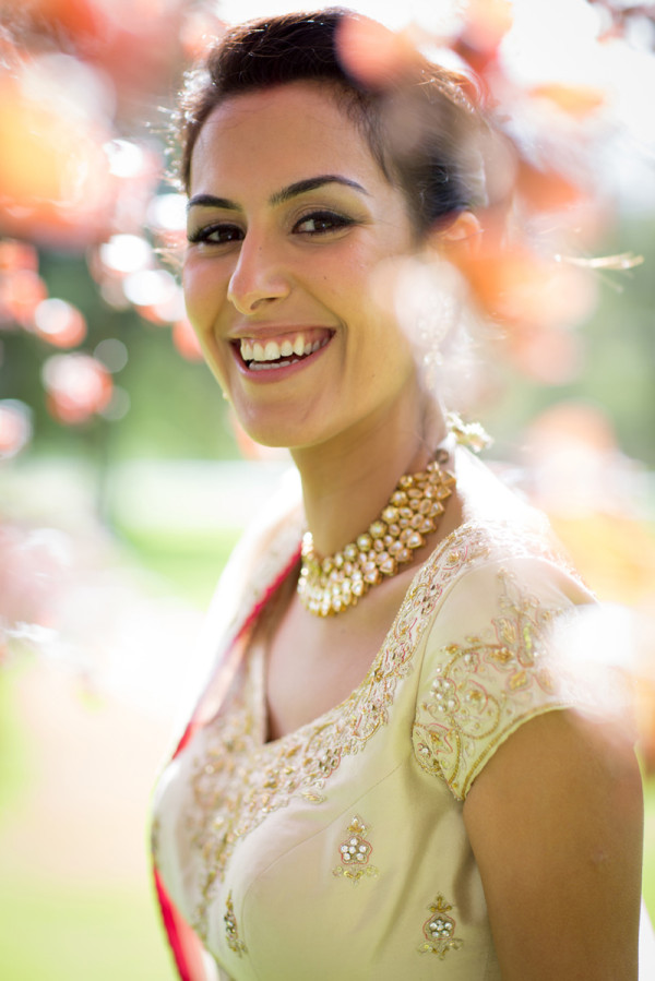 Wedding natural makeup and bridal hair in a soft low bun hairstyle for Asian bride. By Pam Wrigley wedding makeup artist and bridal hair stylist, London.