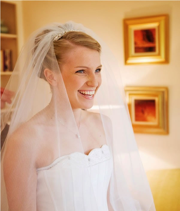 Wedding natural makeup and bridal hair in a soft bun hairstyle for bride. By Pam Wrigley wedding makeup artist and bridal hair stylist, London.