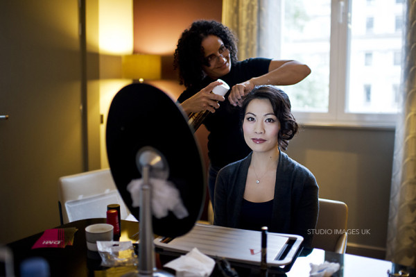 Wedding natural makeup and bridal hair in a soft low bun hairstyle for Asian, Chinese bride. By Pam Wrigley wedding makeup artist and bridal hair stylist, London.