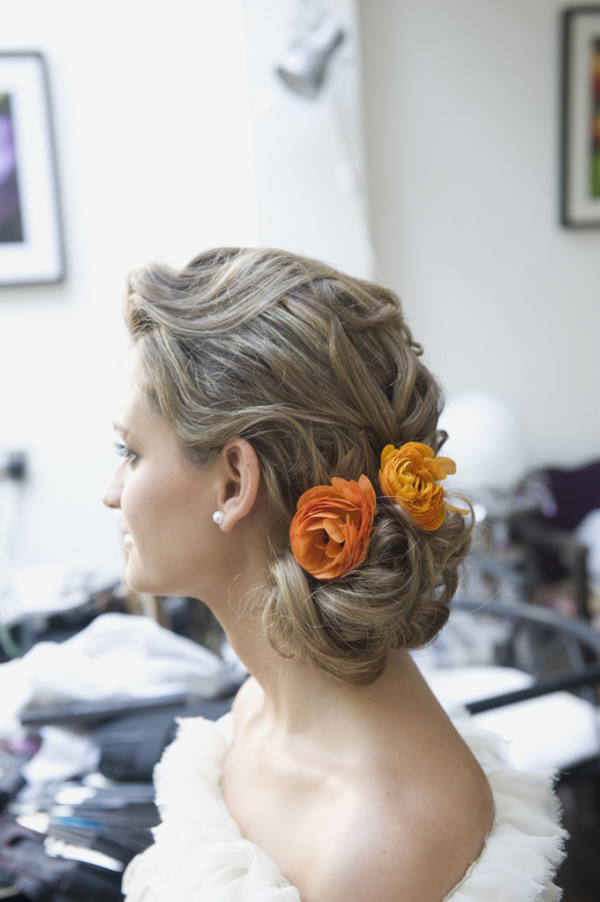 Wedding vintage makeup and bridal hair in a soft low bun hairstyle for bride with soft curls. By Pam Wrigley wedding makeup artist and bridal hair stylist, London.