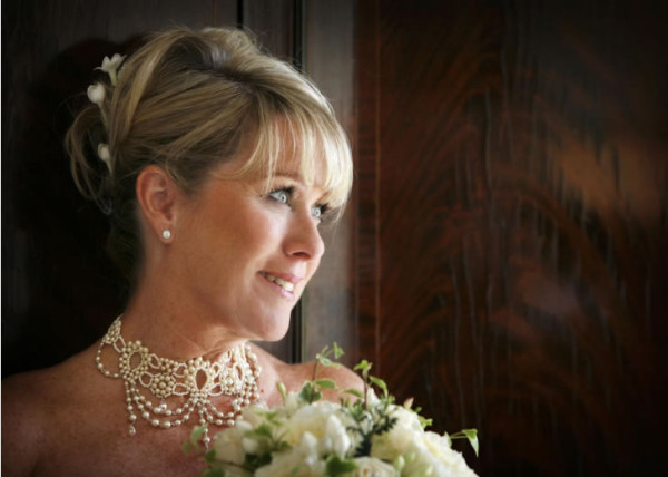 Wedding natural makeup and bridal hair in a smooth sleek hairstyle for mature bride. By Pam Wrigley wedding makeup artist and bridal hair stylist, London.