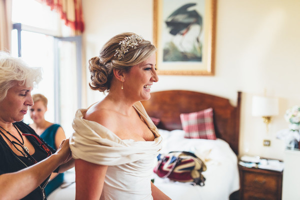 wedding dress. Wedding makeup and bridal hair in a soft low bun hairstyle. By Pam Wrigley wedding makeup artist and bridal hair stylist, Richmond, London.