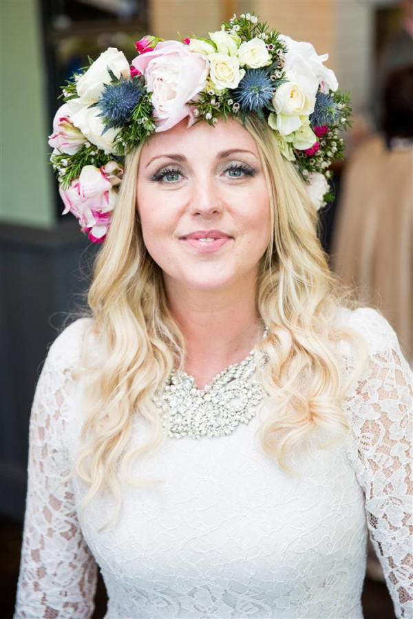 boho bride hair down flowers in the hair by Pam Wrigley bridal hairstylist, and wedding makeup artist