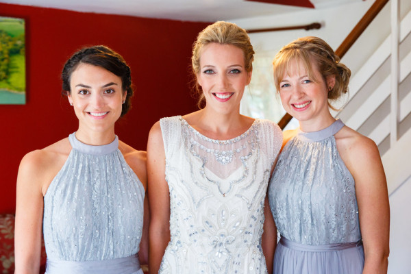 Natural bridal makeup and braided, bridal low bun hairstyles for brides with long hair. Plus makeup by wedding makeup artist and bridal hair stylist Pam Wrigley in Sussex