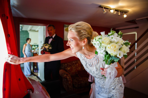 Natural bridal makeup and braided, bridal low bun hairstyles for brides with medium length hair. Plus makeup by wedding makeup artist and bridal hair stylist Pam Wrigley in Sussex
