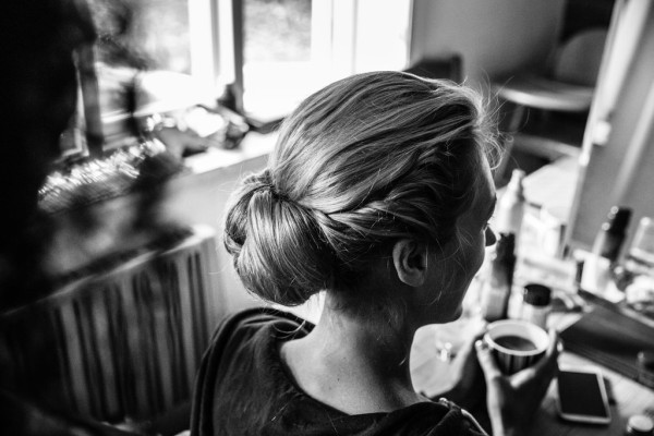 Natural bridal makeup and braided, bridal low bun hairstyles for brides with medium length hair. Plus makeup by wedding makeup artist and bridal hair stylist Pam Wrigley in Sussex