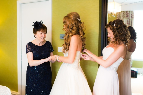Bridal makeup for a bride, plus bridal hairstyles for brides with long, thick, heavy hair with natural curls by wedding makeup artist and bridal hair stylist Pam Wrigley at the St Ermin Hotel
