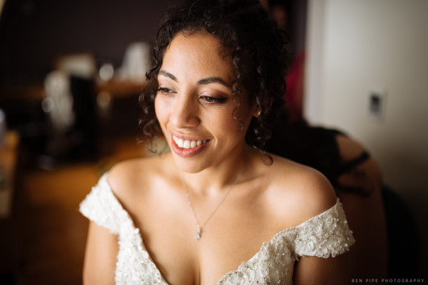 bridal makeup and wedding hairstyles for short naturally curly hair, keep your natural curls for your wedding day low bun hairstyle