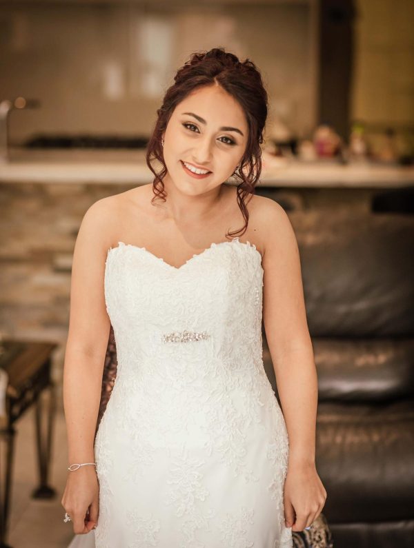 wedding high tumbling bun hair style and bridal makeup by Pam Wrigley bridal hairstylist and wedding mua in West Sussex
