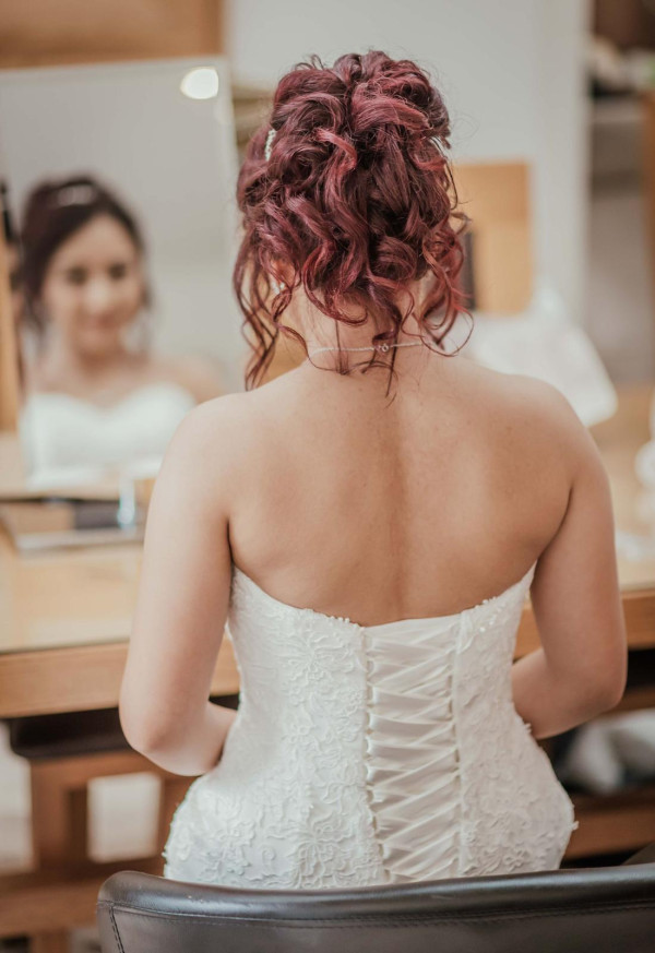 high tumbling bun wedding hair style and bridal makeup by Pam Wrigley